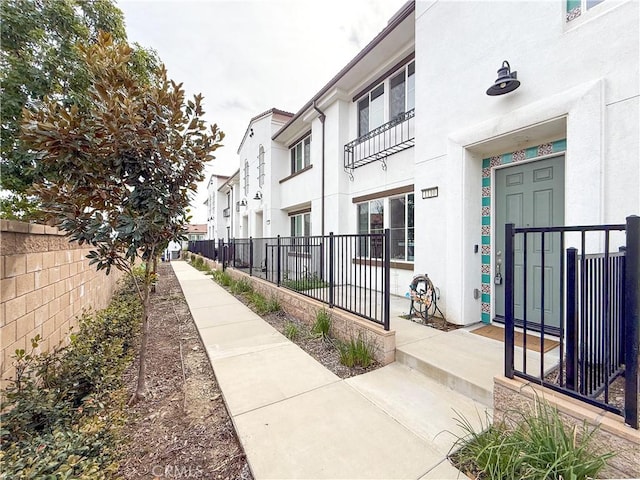 view of property's community featuring fence