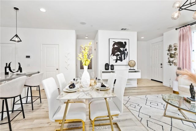 dining room with recessed lighting, visible vents, and light wood finished floors