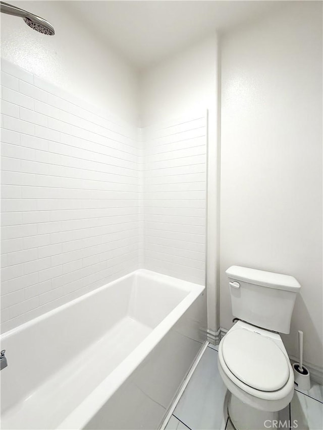 bathroom with a tub to relax in, baseboards, toilet, and walk in shower