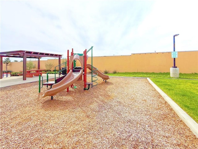 community jungle gym featuring a yard