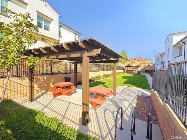 view of property's community with a patio, a fenced backyard, a yard, a residential view, and a pergola