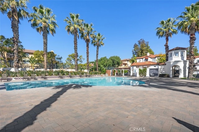 community pool featuring a patio area