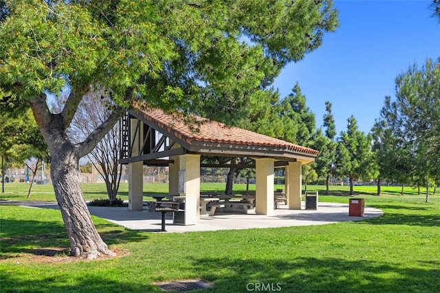 view of property's community featuring a yard and a gazebo