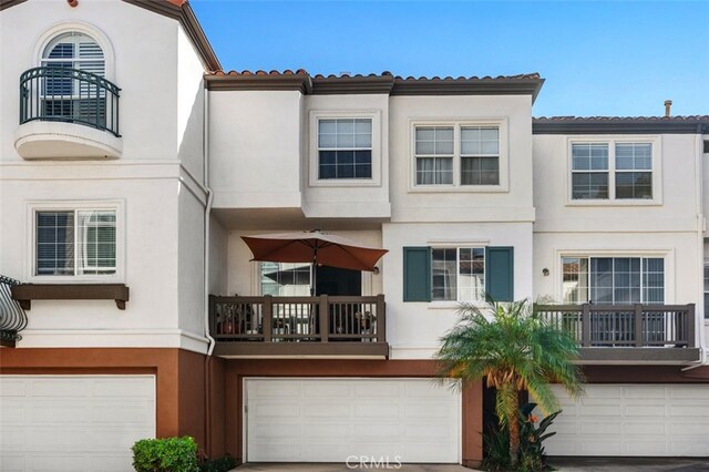 exterior space featuring a garage and stucco siding