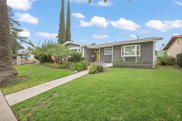 ranch-style home with a front lawn