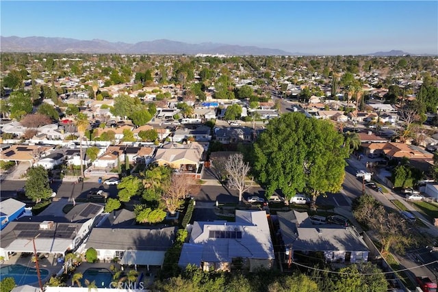 drone / aerial view featuring a residential view and a mountain view