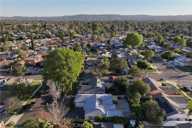 birds eye view of property with a mountain view and a residential view