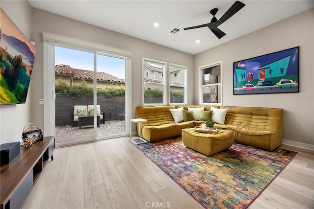 interior space with light wood finished floors, baseboards, visible vents, a ceiling fan, and recessed lighting