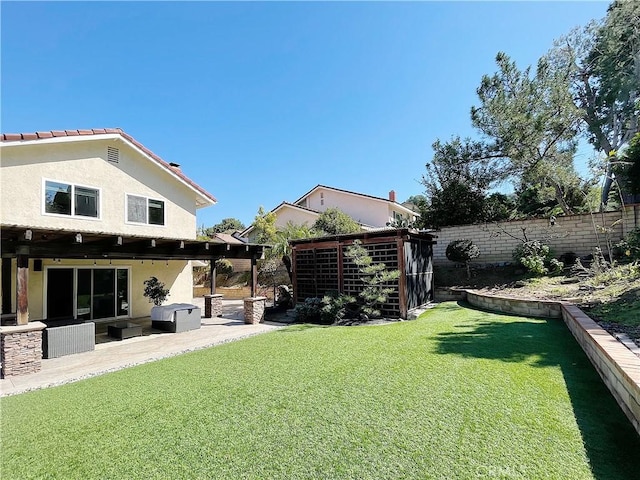 view of yard with a patio area and a fenced backyard