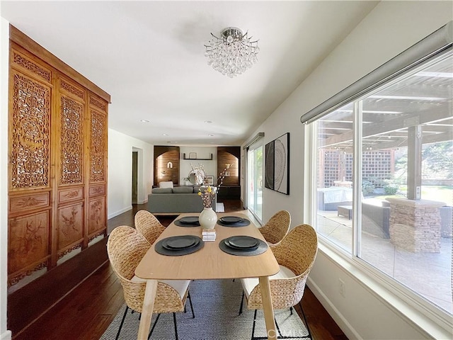 dining area with wood finished floors and baseboards