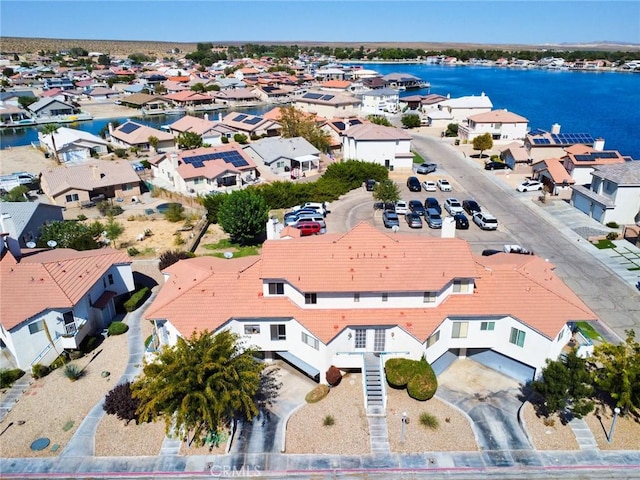 aerial view with a water view and a residential view