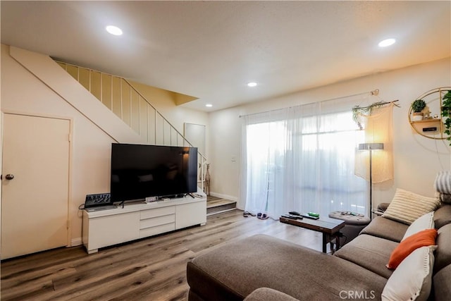 living room with wood finished floors and recessed lighting