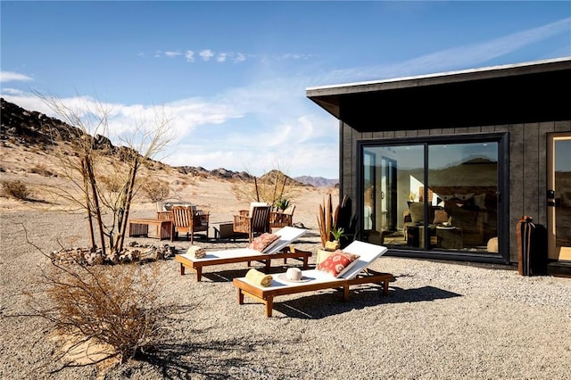 view of patio / terrace with a mountain view