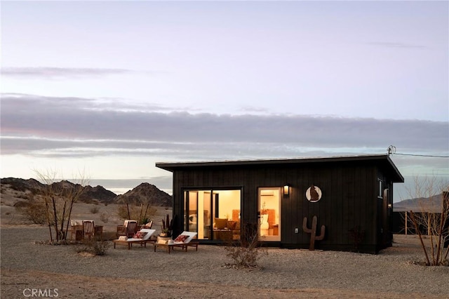 back of house featuring a mountain view