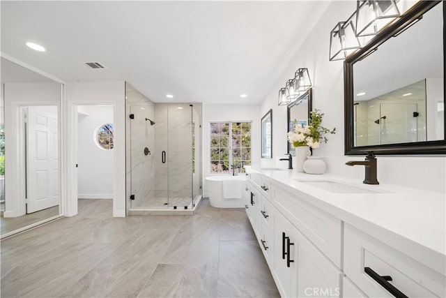 full bath featuring a soaking tub, visible vents, a sink, and a shower stall