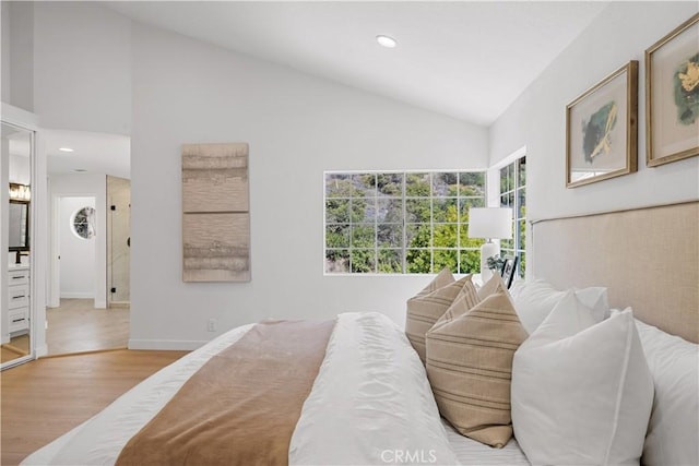 bedroom featuring baseboards, vaulted ceiling, wood finished floors, and recessed lighting