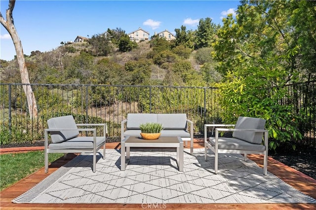 view of patio with outdoor lounge area and fence