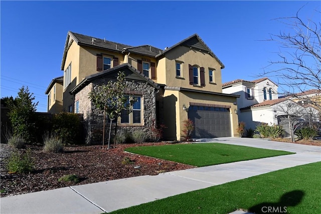 traditional home with stucco siding, concrete driveway, an attached garage, a front yard, and stone siding