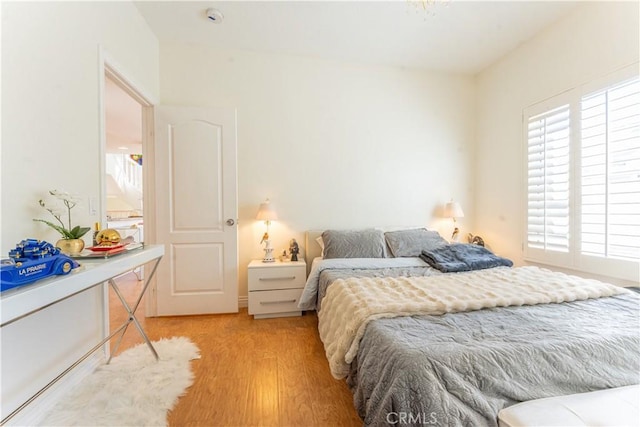 bedroom with light wood finished floors