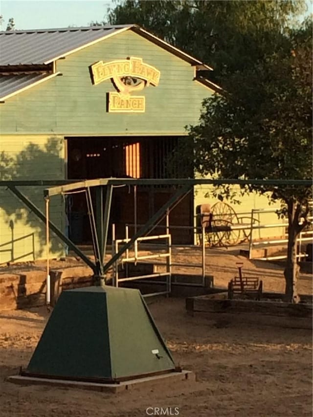 view of community with an outdoor structure and an exterior structure