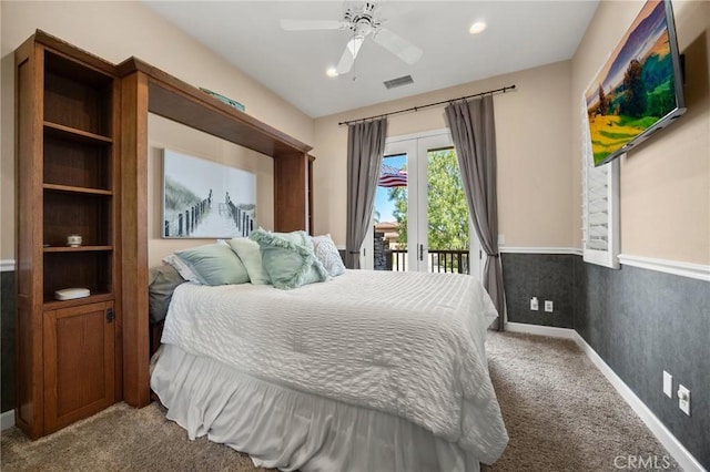 carpeted bedroom featuring ceiling fan, recessed lighting, a wainscoted wall, visible vents, and access to outside