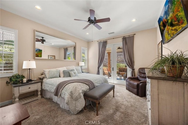 bedroom with recessed lighting, light colored carpet, visible vents, access to outside, and french doors