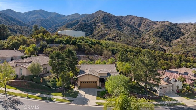 drone / aerial view with a residential view and a mountain view