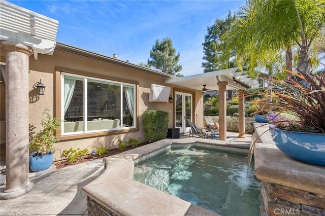 view of pool featuring a ceiling fan and a patio area