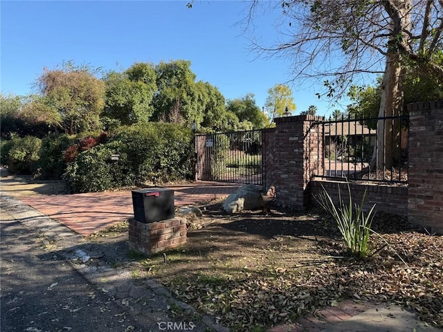 view of gate featuring fence