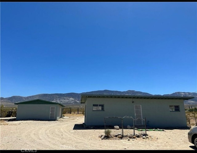 view of side of property with a mountain view