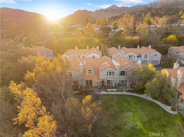 drone / aerial view with a residential view and a mountain view