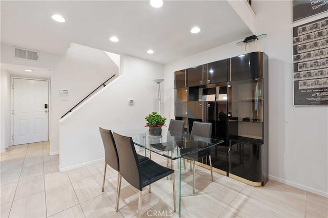 dining room with light tile patterned flooring, baseboards, visible vents, and recessed lighting