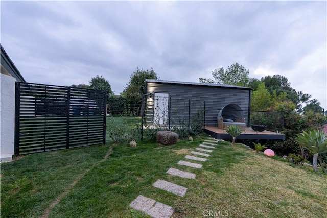 view of yard with fence and a deck