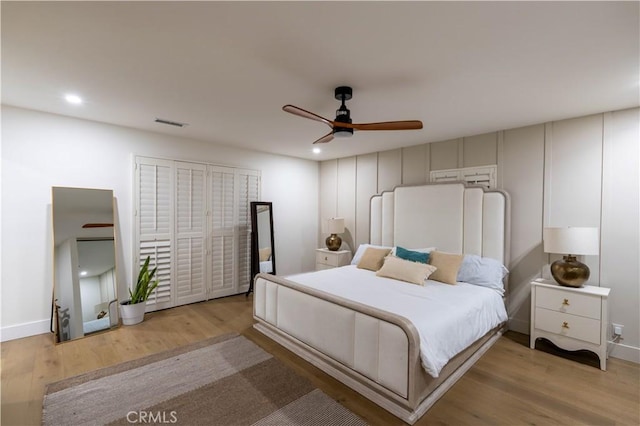 bedroom featuring visible vents, baseboards, light wood-style flooring, ceiling fan, and recessed lighting