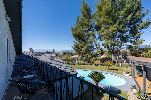 balcony featuring a mountain view