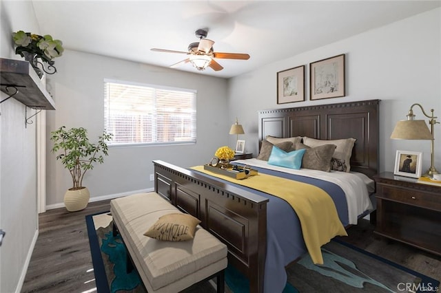 bedroom featuring ceiling fan, baseboards, and dark wood-type flooring