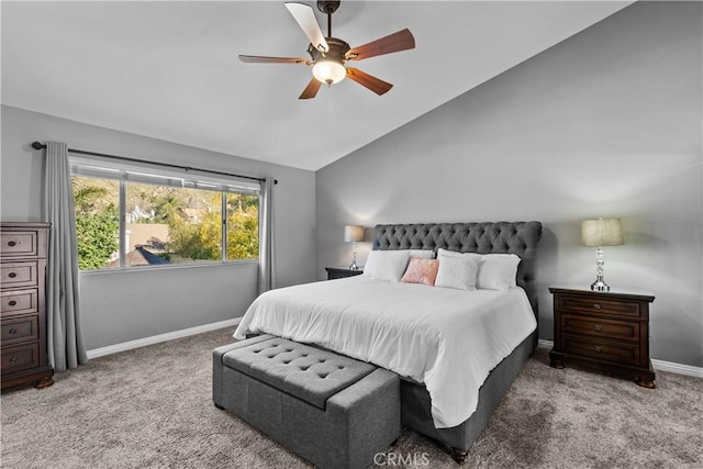 carpeted bedroom with vaulted ceiling, ceiling fan, and baseboards