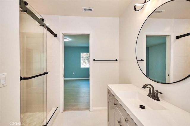 5386 Harter Ln, La Canada Flintridge, CA 91011 - bathroom featuring a shower stall, vanity, and baseboards