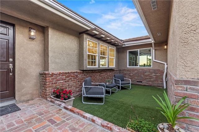 5386 Harter Ln, La Canada Flintridge, CA 91011 - view of exterior entry featuring stucco siding, brick siding, and a yard