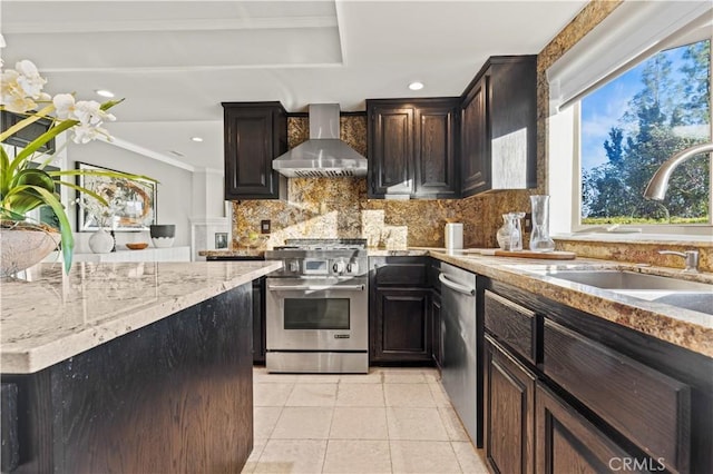 5386 Harter Ln, La Canada Flintridge, CA 91011 - kitchen featuring wall chimney exhaust hood, appliances with stainless steel finishes, a sink, decorative backsplash, and light stone countertops