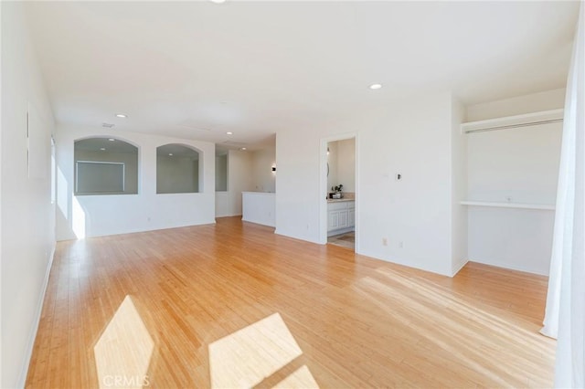 unfurnished living room with recessed lighting and light wood-style floors