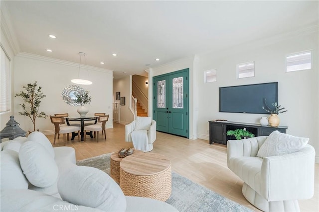 living room with recessed lighting, baseboards, stairway, light wood-type flooring, and crown molding