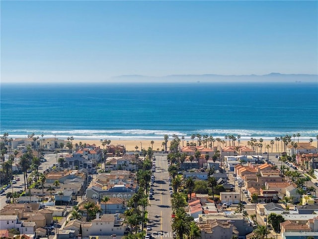 birds eye view of property with a water view, a residential view, and a view of the beach