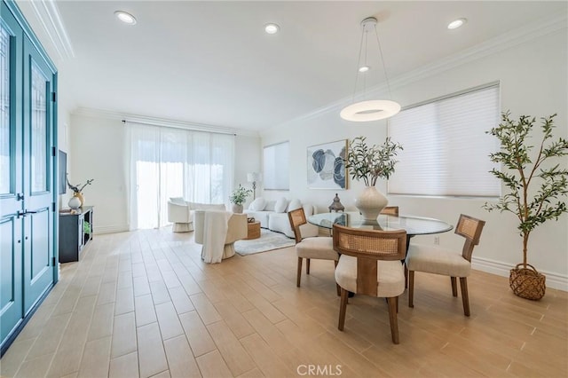 dining space featuring crown molding, recessed lighting, and light wood-style floors