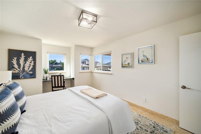 carpeted bedroom with baseboards