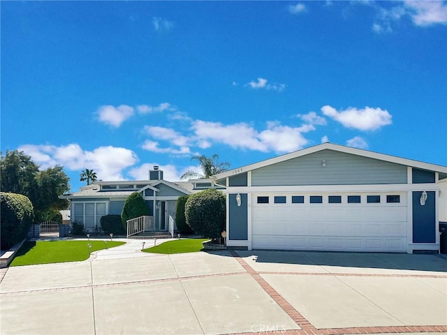 view of front of home with driveway and an attached garage