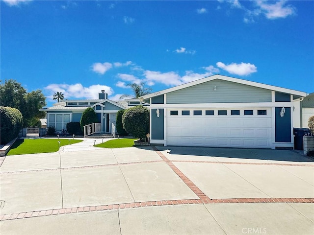 view of front facade featuring a garage and concrete driveway