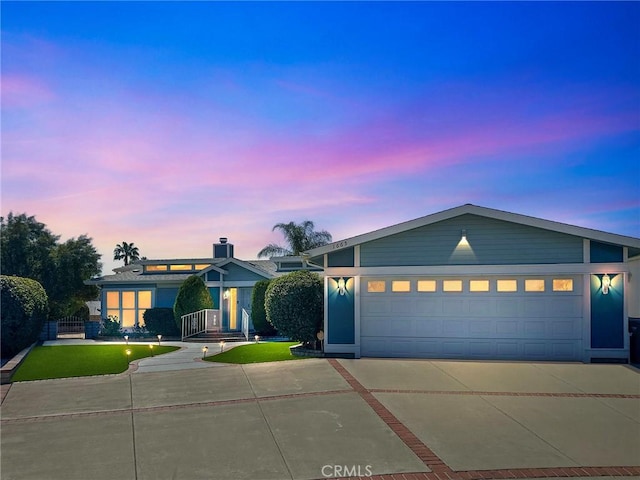 view of front of property with a garage and driveway