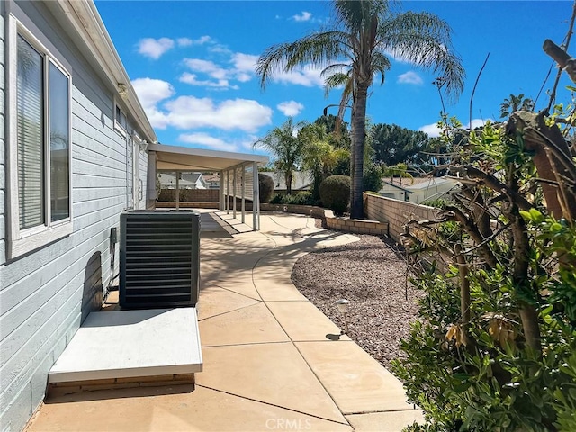 view of patio / terrace with central AC and a fenced backyard