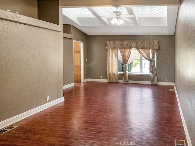 unfurnished room featuring baseboards, visible vents, coffered ceiling, ceiling fan, and dark wood-type flooring